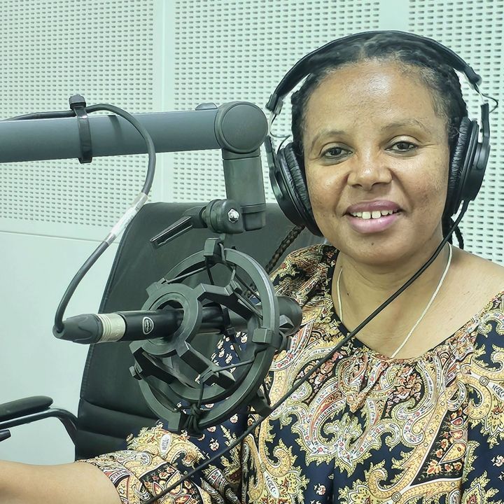 Female radio moderator on the microphone.